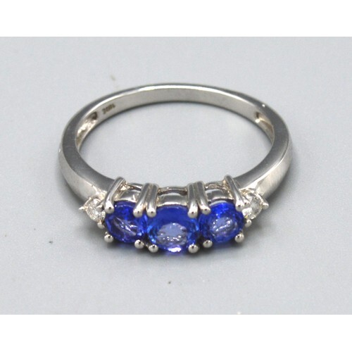 An 18ct. White Gold Tanzanite and Diamond Ring set with thre...