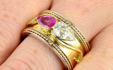 An 18ct gold bi-colour band ring, with pear-shape old-cut diamond and ruby highlights.