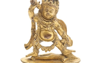An 18th-19th century Tibetan gilt bronze figure of the two armed Mahakala. Bottom sealed. H. 9.5 cm.