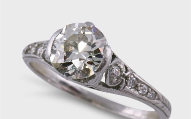 An Art Deco diamond and platinum ring centering an...