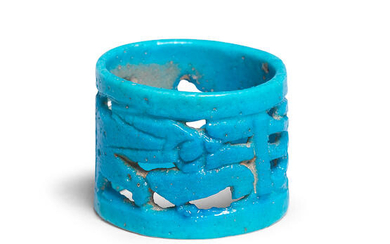 An Egyptian turquoise faience openwork ring