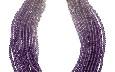 An amethyst multi-row necklace, composed of uniform rows of faceted amethysts of graduated tones, to a hook clasp, stamped 750, approx. length 41cm
