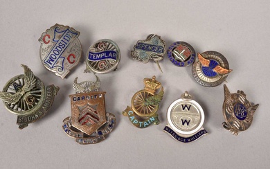 An assortment of Cycling medals and buttons