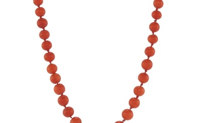 An early 20th century coral single-strand necklace, with cor...