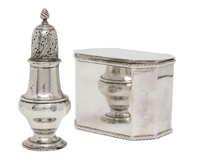 An early George III silver caster, London, 1763, John Delmester, of circular baluster form with pierced domed cap and crest engraved to body, 13cm high, together with an unmarked white metal tea caddy, of octagonal form with gadrooned band to rim...