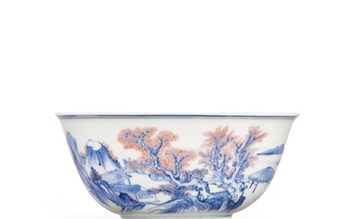 An underglaze-blue and copper-red 'landscape' bowl, Qing dynasty, Kangxi period...