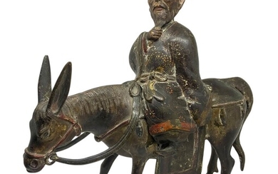 Antico Zhang Guolao, Cina. Incensiere in bronzo patinato bruno a cera persa...
