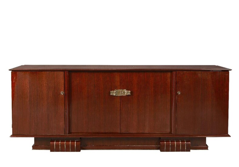 Attributed to Dominique (French), an Art Deco rosewood sideboard, Circa 1930, The long top with bevelled border having a pair of central cupboards below flanked on each side by a single cupboard, enclosing blond oak interiors, having three drawers...
