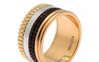 Boucheron: A “Quatre Classique Large” ring set with brown PVD, mounted in 18k tri-colour gold. Ref. no. JGR00257–56. Size 57.