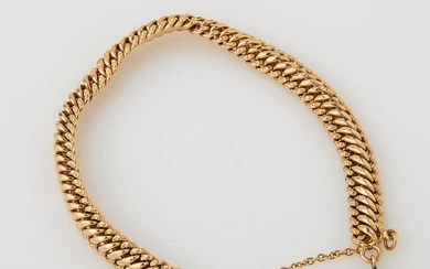 Bracelet souple en or jaune (18 K) maille américaine avec chainette de sécurité. Poids :...