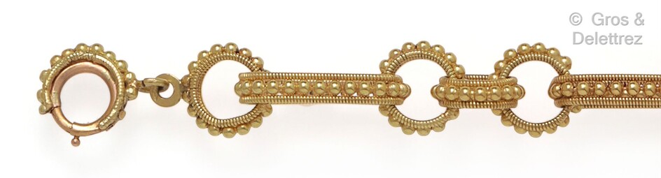 Bracelet souple en or jaune à décor de torsades...