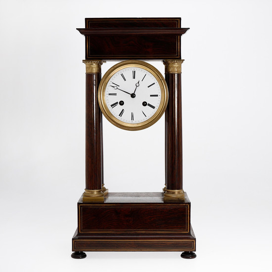 Charles X "portico" table clock with case in rosewood and gilt bronze, second quarter of the 19th Century.