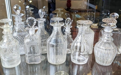 DECANTERS, a collection of ten, various cut glass decanters,...