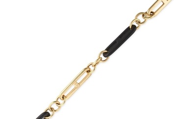 GUCCI, AN EBONY BRACELET comprising a row of alternating ebony and gold fancy links, signed Gucci...