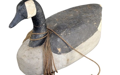 Large vintage duck decoy with rope and iron weight