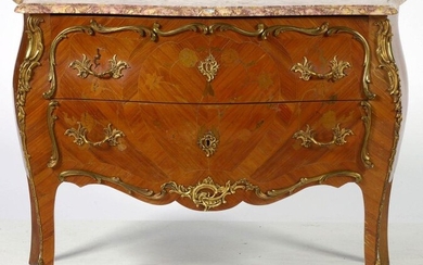 Louis XV style chest of drawers made of veneered wood and floral marquetry opening by two drawers. Gilt bronze ornamentation. Violet brocatelle (?) shelf. Period: circa 1900. Size : 118,5x86,5x47cm.
