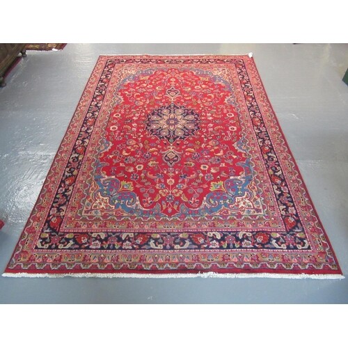 Middle Eastern design Mashad carpet on a mainly red ground w...