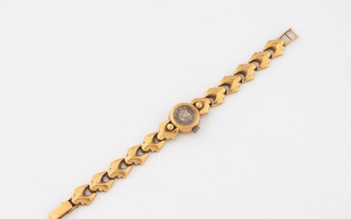 Montre bracelet de dame en or jaune (750). Boîtier rond. Cadran à fond argenté, index...