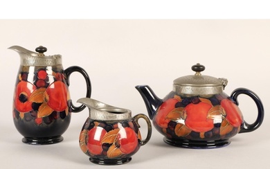 Moorcroft pottery Tudric pewter three piece tea service, pom...