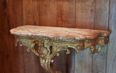 Moulded, carved and gilded wood console with foliage...