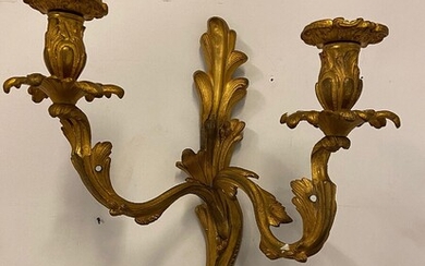 NOT SOLD. One French Rococo style gilded bronze wall light with curved twin candle holders...