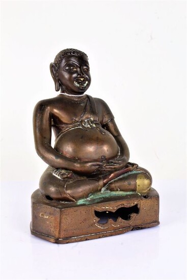 Oriental bronze Buddha, with short hair above long ear lobes and a large stomach on a plinth base