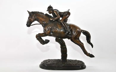PATINATED BRONZE OF A JUMPING HORSE WITH RIDER