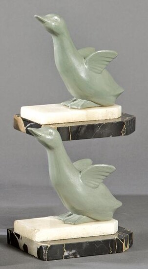 Pair of Art Deco bookends, in patinated metal and