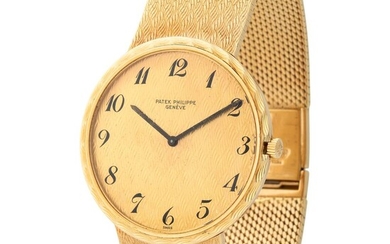 Patek Philippe. Rare and Elegant Chevron Gold Wristwatch in Yellow Gold, Reference 3588-2, Box, Certificate and Booklets