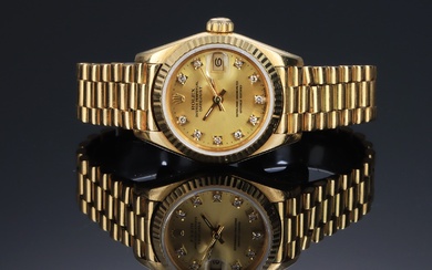 Rolex 'Datejust'. Ladies' watch in 18 kt. gold with diamond-studded disc, approx. 1990