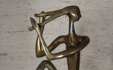 Sculpture en bronze représentant une femme nue assise, numérotée 3/500 H : 39 cm.