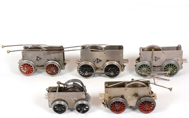 Six Hornby O gauge model railway clock-work motor chassis for locomotives, all loose.