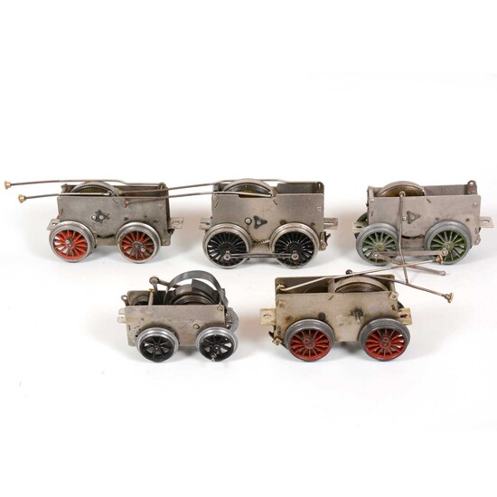 Six Hornby O gauge model railway clock-work motor chassis for locomotives, all loose.
