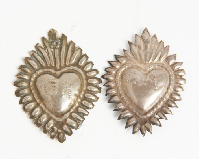 TWO EARLY 20TH CENTURY PERUVIAN SILVER RELIGIOUS ICONS (SACRED HEARTS), EMBOSSED INITIALS (GA AND GR), COMPLETE WITH PERUVIAN 'ARTEF...