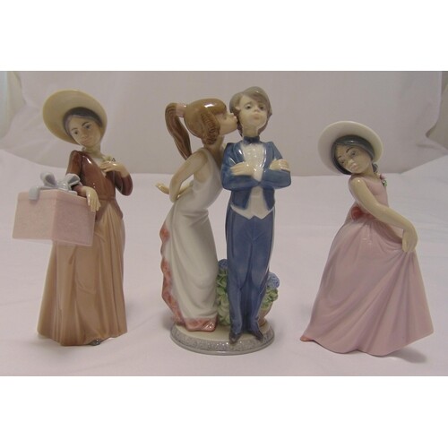 Three Lladro figurines of children in various poses, tallest...