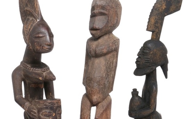 Three ancestor figures of carved patinated wood. Yoruba and Lobi style. H. 50–56 cm. (3)