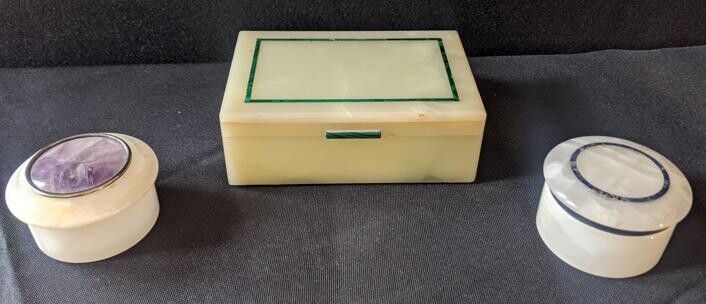 Two stone dressing table boxes, one inlaid with
