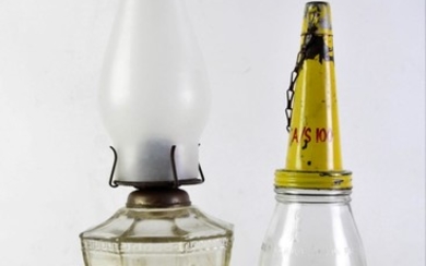 Vintage oil bottle together with a kerosene lamp