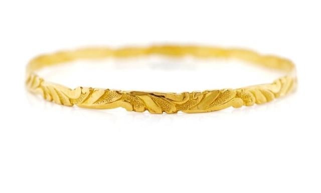 Yellow gold "scroll" bangle rubbed mark. Approx flat wire si...