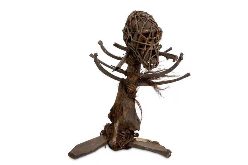 A 19TH CENTURY AFRICAN WITCH DOCTOR STAFF (FETISH) FORMED...