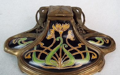Art Nouveau ceramic inkwell with brass cage surround. 8 inches wide. JBT anno 1906 to base.