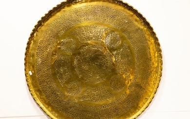 A Brass circular carved tray