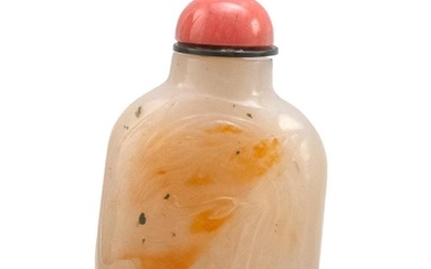 CHINESE RUSSET AND WHITE AGATE SNUFF BOTTLE In modified rectangular form, with phoenix carving. Height 2.5". Simulated coral stopper.