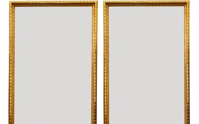 A large pair of carved and gilded picture frames