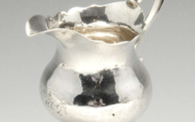 A George III silver pedestal cream jug by Hester Bateman.