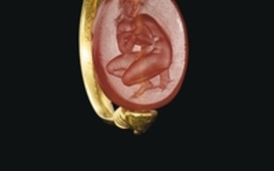 A GREEK GOLD AND CARNELIAN SCARAB SWIVEL RING WITH APHRODITE, CLASSICAL PERIOD, CIRCA 4TH CENTURY B.C.