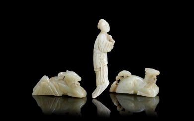 A group of three pale green jade carvings