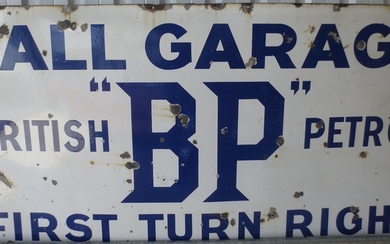 A large BP Hall Garage enamel sign