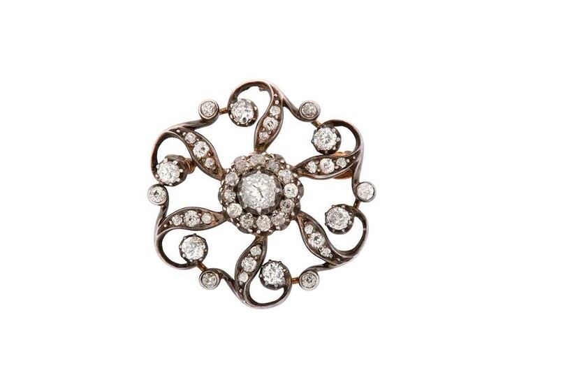 A diamond brooch, circa 1890 The openwork stylised flowerhead,...