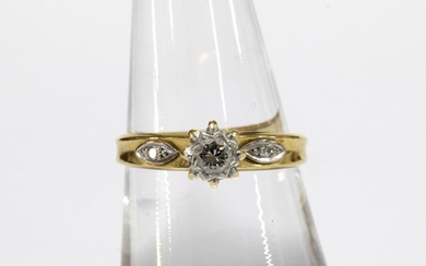 18ct gold ring with a claw set diamond in a high platinum se...